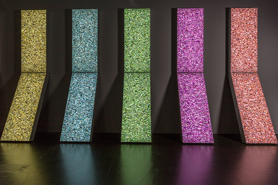 Hasan Elahi - Stelae 10.4 feet x 32.5 feet x 20 inches Translucent pigment prints on lightboxes (as installed at Zentrum für Kunst und Medientechnologie Karlsruhe, Germany, 2015) Courtesy of the artist and Zentrum für Kunst und Medientechnologie Karlsruhe