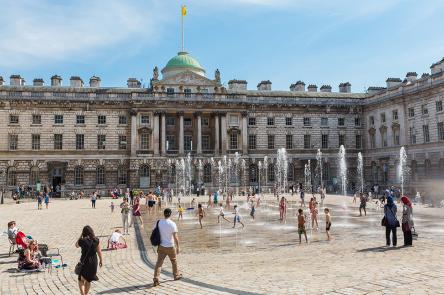 People enjoying The Edmond J. Safra Fountain Court, Somerset House