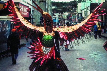 Horace Ové photograph of Trinidad Carnival showing a reveller in an elaborate bird suit