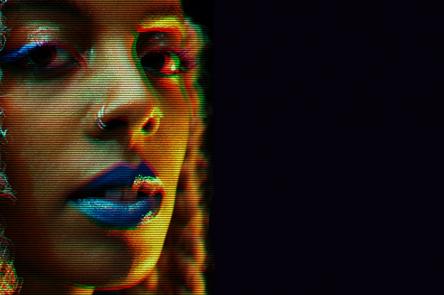 A photo of Juliana Huxtable, with a glitch effect and a black background.