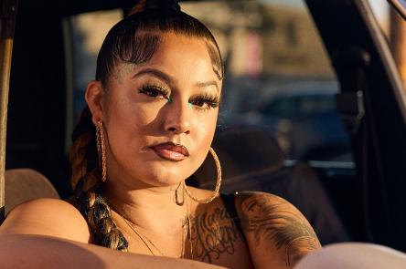 An image selected for the 2024 Sony World Photography Awards. A woman sits in the front seat of a car, with her arm on the ledge of the car's open window.