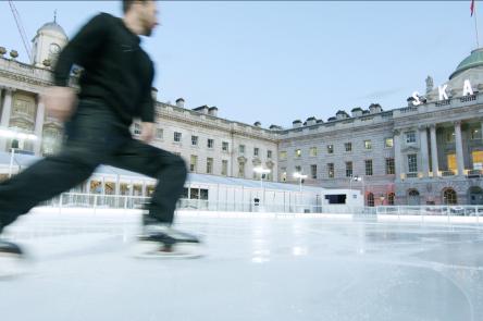 Person skating on the ice rink at Somerset House