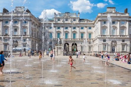 People playing in the fountains, The Edmond J. Safra Fountain Court, Somerset House