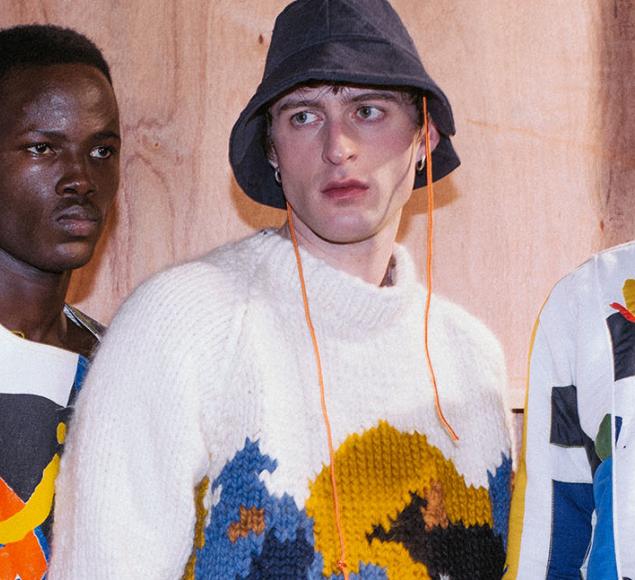 A photo of 3 men wearing patterned clothes at a fashion show, designed by Bethany Williams