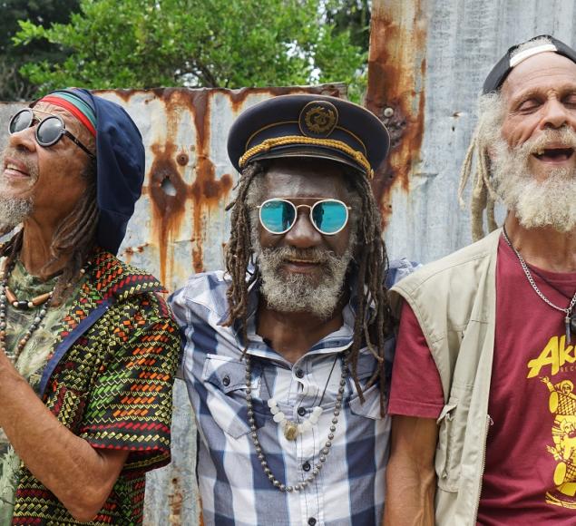 Film still of reggae legends Winston McAnuff, Kiddus I and Cedric Myton looking at the camera. Image courtesy of Picturehouse