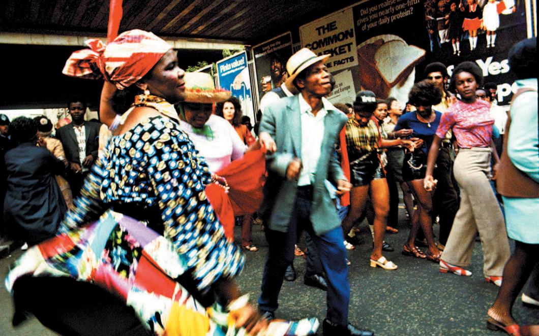 Photograph by Horace Ové showing revellers at Notting Hill Carnival in 1969