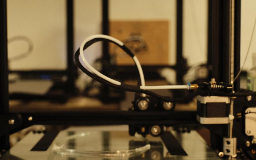 A photo of a close-up a 3-D printer. 