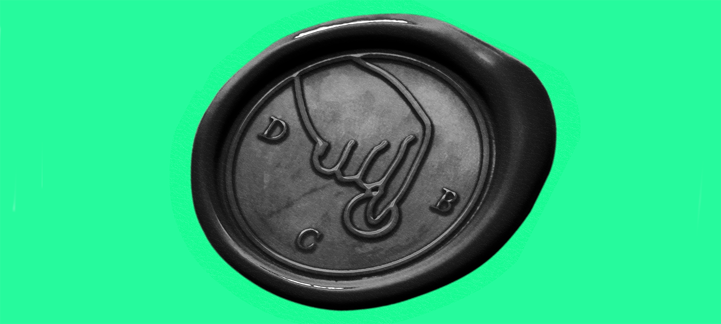 A promotional image for Dead Cat Bounce. A black wax seal depicting a finger pushing a button. Around the image are the letters D C and A. This is presented on a mint green background.