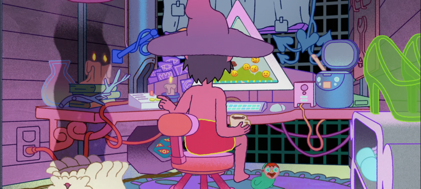 A cartoon illustration of an office scene, with person sat at a computer wearing a witches hat. They have their back to their viewer, sat on a chair with a coffee in hand.. It is night and there are lit candles.  On the screen are bouncing yellow emojis.