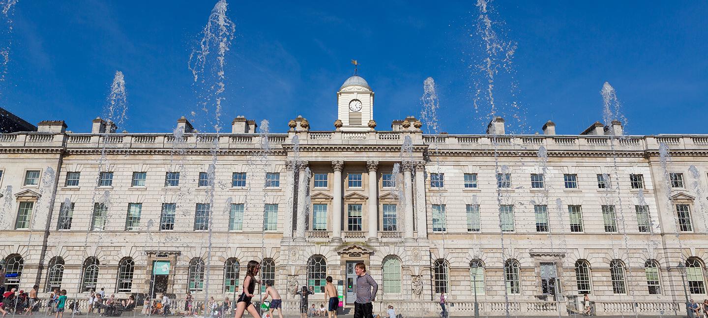 People playing in the fountains