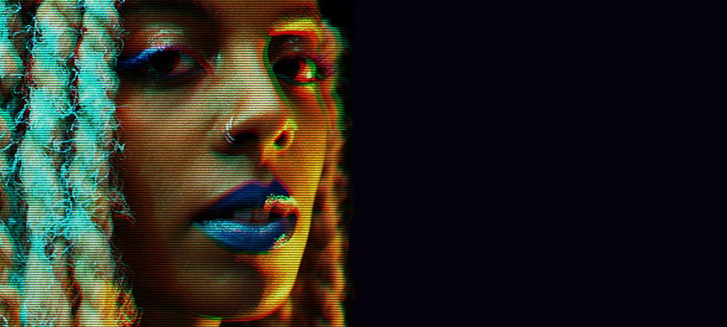 A photo of Juliana Huxtable, with a glitch effect and a black background.