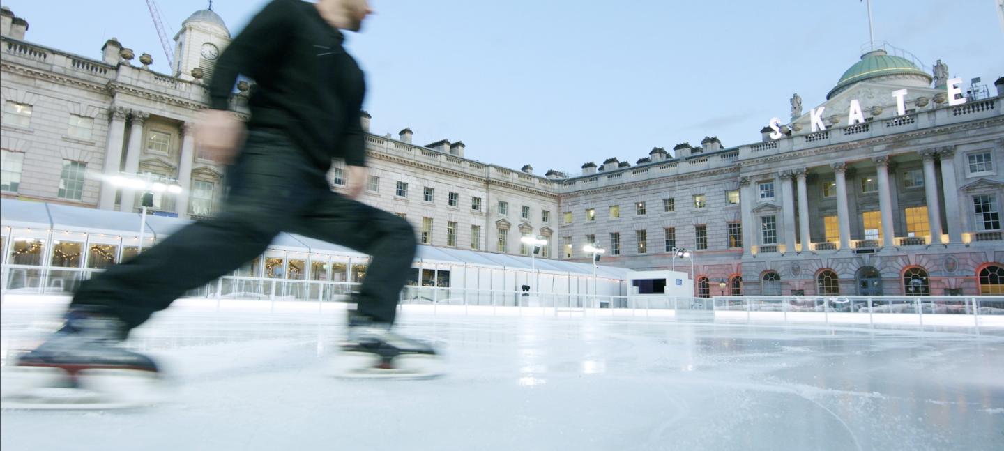Person skating on the ice rink at Somerset House
