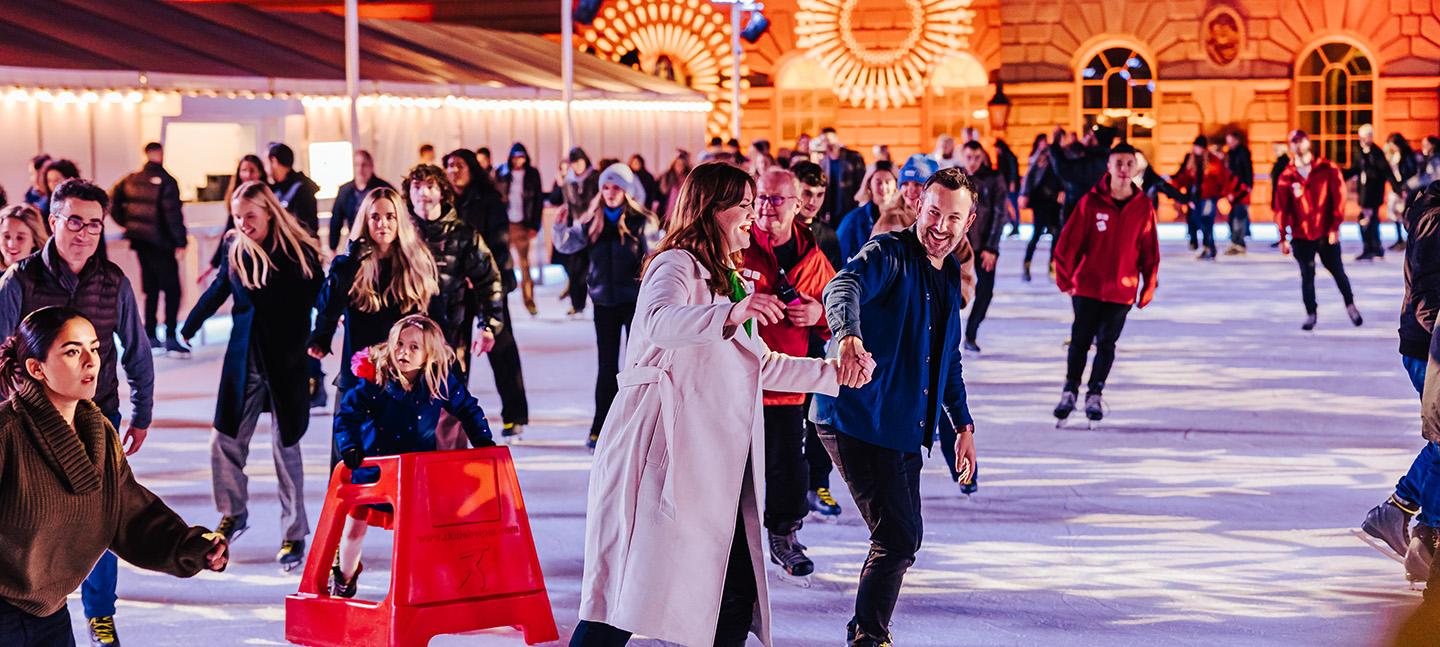 Skaters on the ice at Somerset House, having a good time.