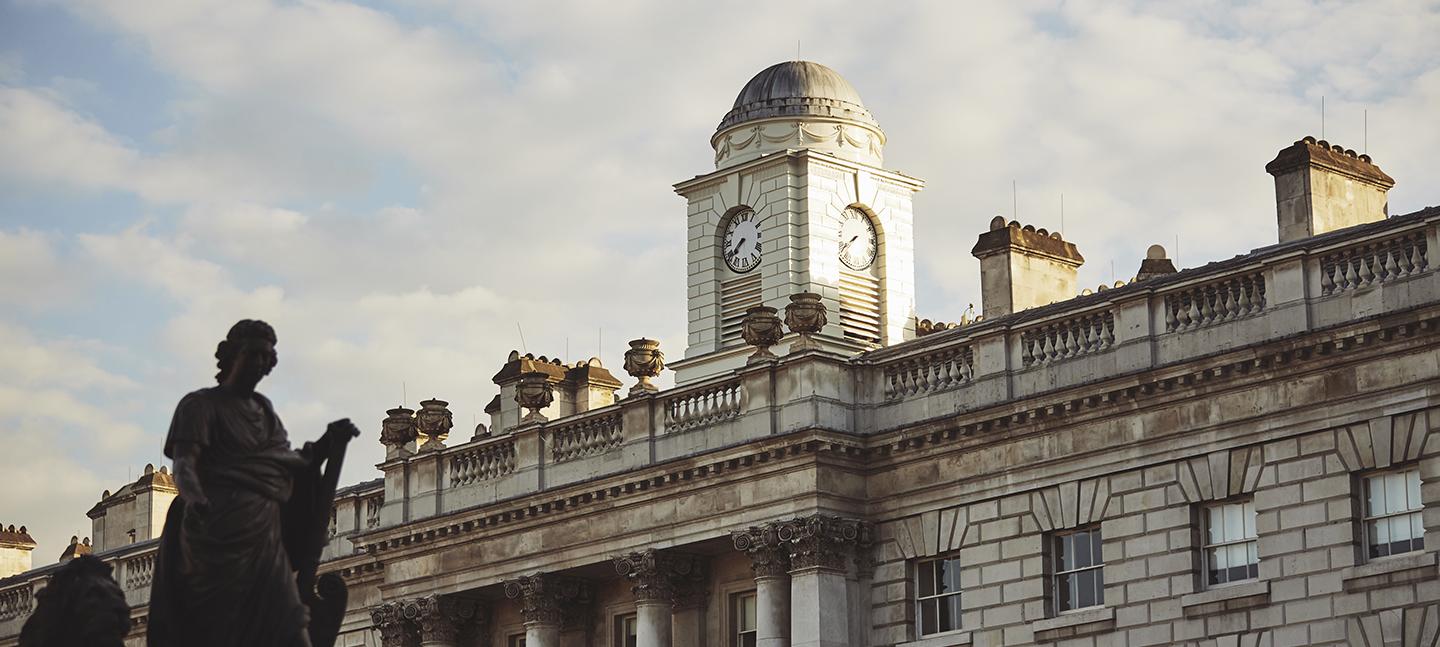 A photo of the roof of Somerset House with blue skies