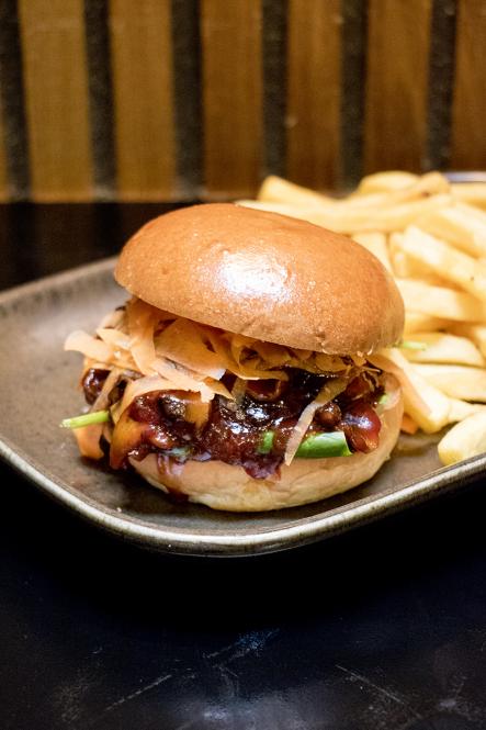 A pulled BBQ mushroom sandwich and chips at Bodeans smokehouse