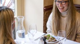 Woman laughing in Boulevard Brasserie restaurant