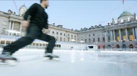 Person skating on the ice rink at Somerset House