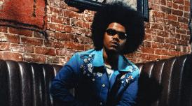 A photo of the US hip hop artist Smino wearing sunglasses
