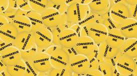 A graphic illustration of a piles of badges, which are circular and yellow, with the words 'Conserve me' printed on them.