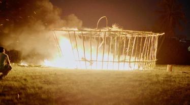 Still from R.I.P Germain - mew (2022) XII featuring a structure on fire