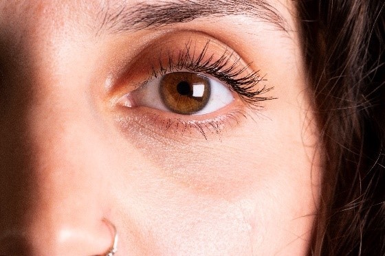 A photo of a close up of a woman's eye